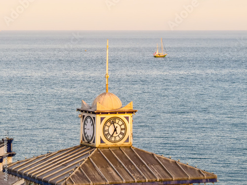 Old clock on a tower of Eastbourne's Pier photo