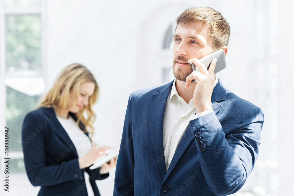 Male and female office workers. Male and female office workers.
