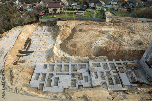 foundation of new construction at a building site photo