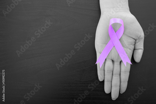 .Vulvar Cancer ribbon holding by woman photo