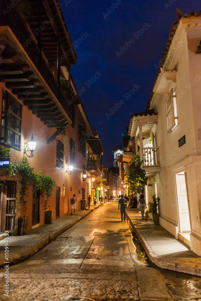 Fototapeta premium People walk at the streets of Cartagena during the evening.