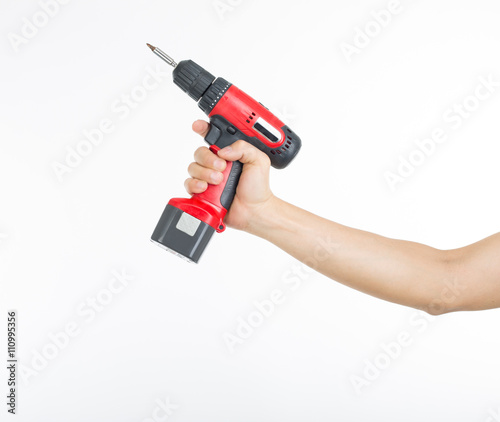 Konstfotografi .Cordless screwdriver holding by hand