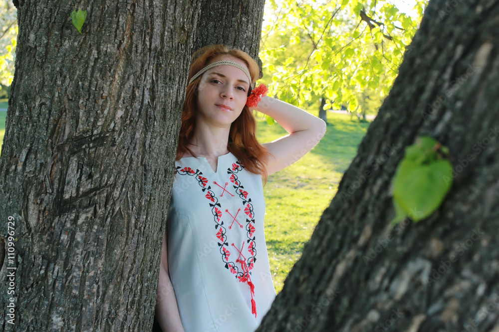 Girl hippie near tree