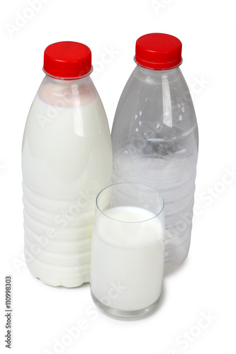 Glass jug with milk on white background