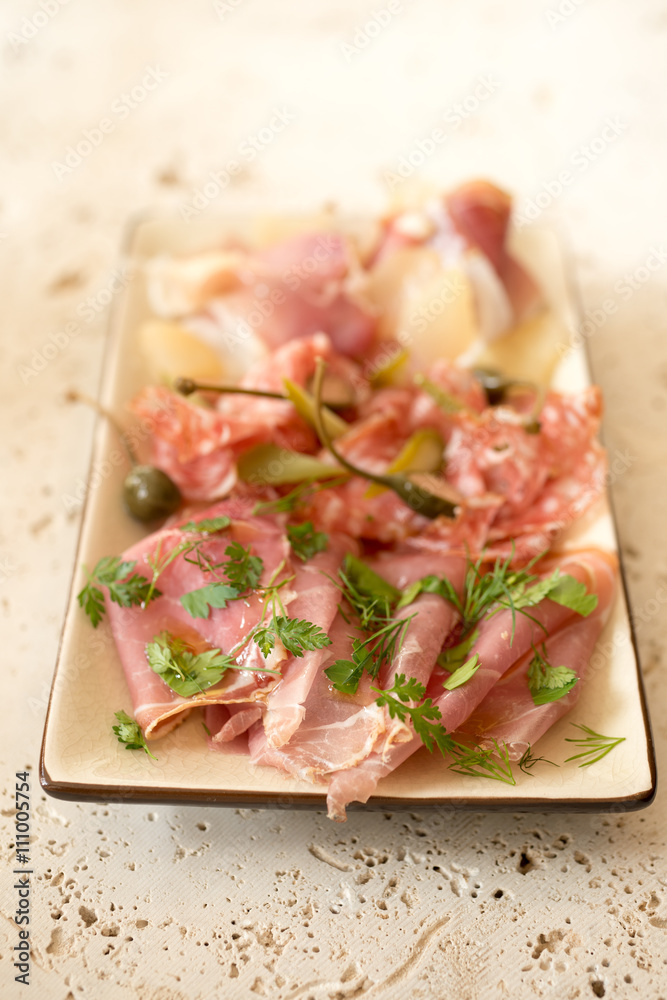 Deli or Lunch Meat and Greens in a Rectangular Plate Deli or Lunch Meat and Greens in a Rectangular Plate