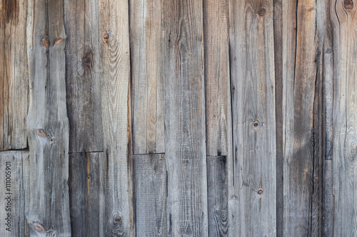 Wooden background of the old, rotten planks.