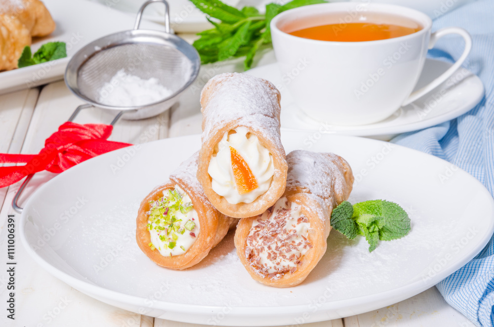 Homemade cannoli stuffed with ricotta cheese cream Homemade cannoli stuffed with ricotta cheese cream
