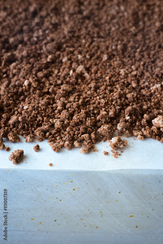 Extreme close-up of homemade edible crystallized chocolate soil for dessert presentation. Selective focus. Extreme close-up of homemade edible crystallized chocolate soil for dessert presentation. Selective focus.