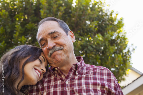 Father and daughter sharing tender moment photo