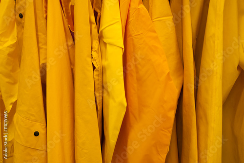 Bright Yellow rain jackets background coat