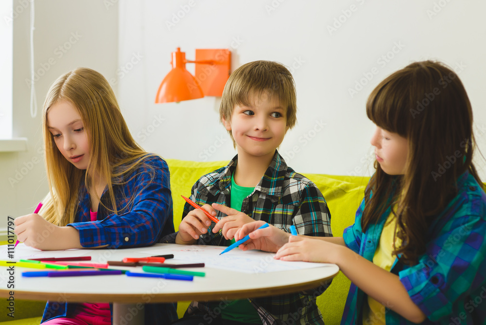 happy Little girls and boy drawing pictures. Indoor at room happy Little girls and boy drawing pictures. Indoor at room