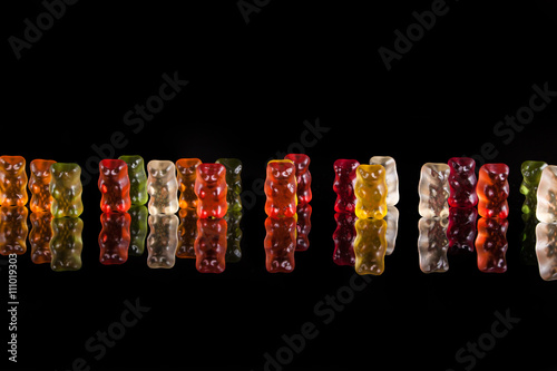 gummy bears on a black background