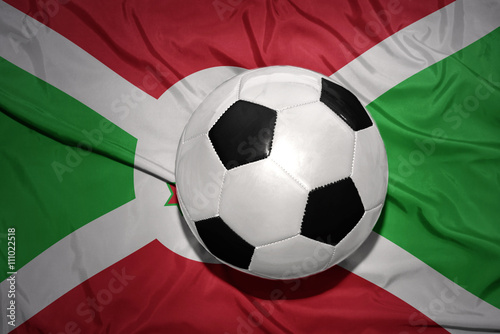 black and white football ball on the national flag of burundi