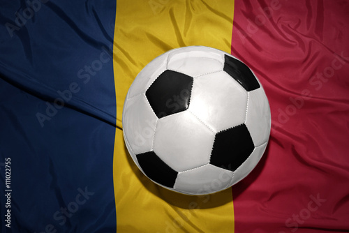 black and white football ball on the national flag of chad