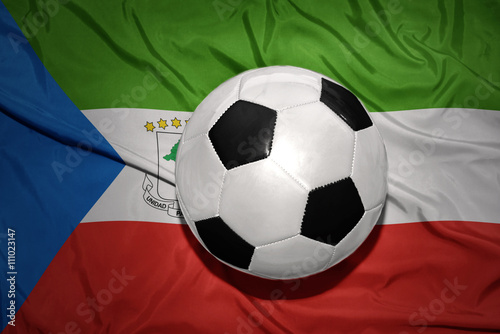 black and white football ball on the national flag of equatorial guinea