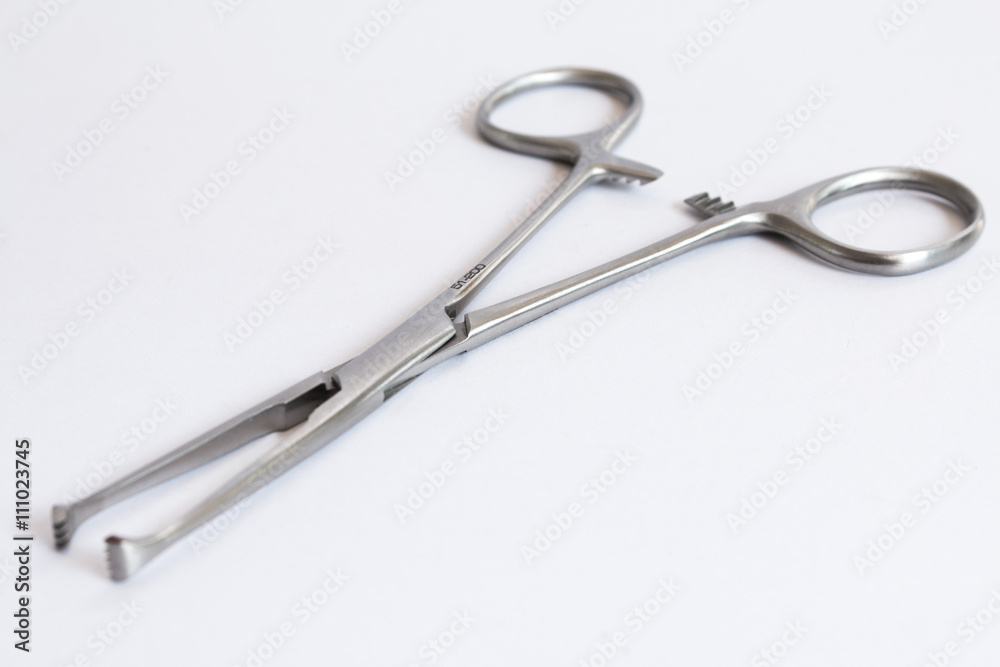 surgical instruments and tools including , forceps and tweezers White background surgical instruments and tools including , forceps and tweezers White background
