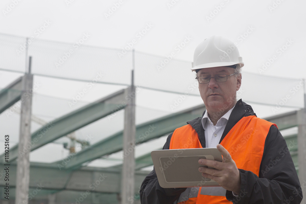 Dock worker using digital tablet at port Dock worker using digital tablet at port