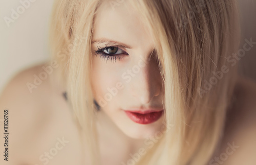 Blond Hair. Beautiful Sexy Blonde Girl. Beauty isolated on a Black Background