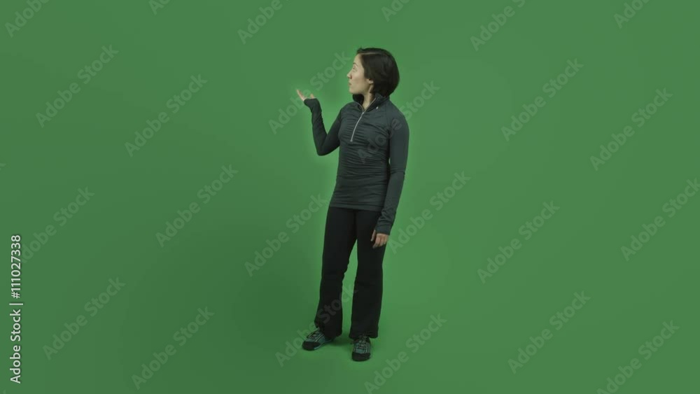 caucasian sporty girl isolated on green screen talking pointing caucasian sporty girl isolated on green screen talking pointing