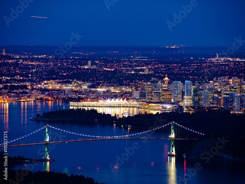 Fototapeta Naklejka Na Ścianę i Meble -  Night City View. Harbor, Port and Bridge. View from Cypress Mountain.  Vacouver downtown and Metro Vancouver, British Columbia, Canada.