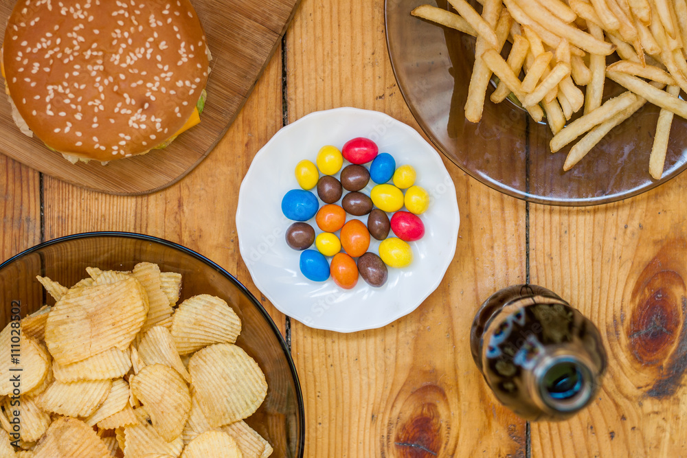 Fast food set big hamburger and french fries on wood background Fast food set big hamburger and french fries on wood background