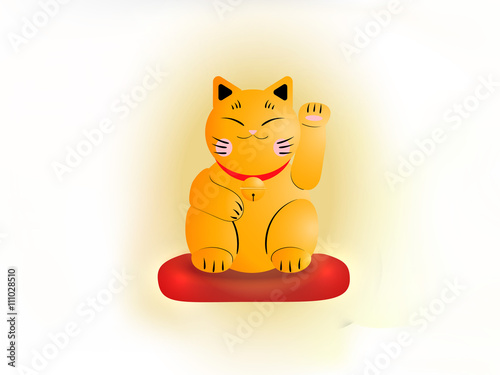 Yellow cat maneki neko on a red pillow
