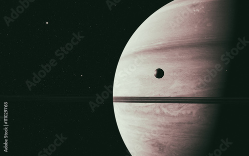 planet Saturn along with its moon rhea, close up photo