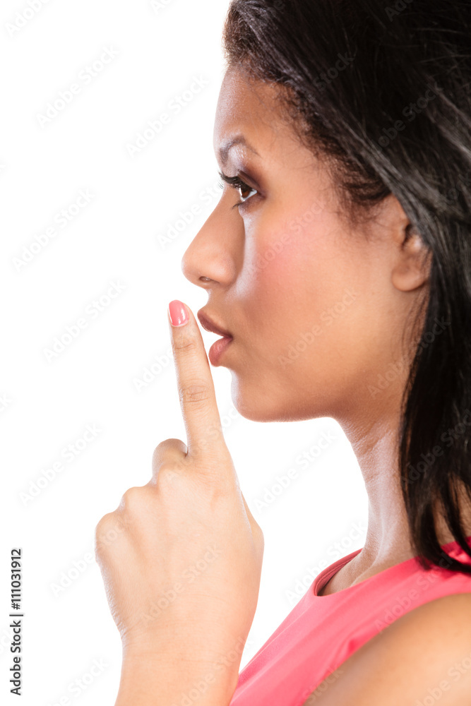 Woman with finger on lips showing silence gesture. Woman with finger on lips showing silence gesture.