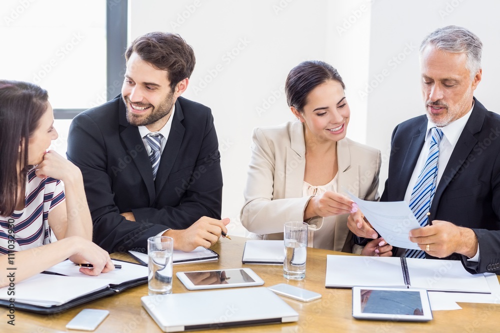 Workers are talking to each other and smiling Workers are talking to each other and smiling