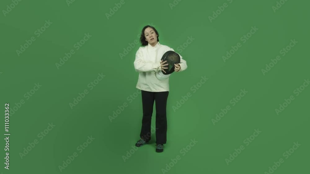 caucasian fencing with sword girl isolated on green screen talking interview
