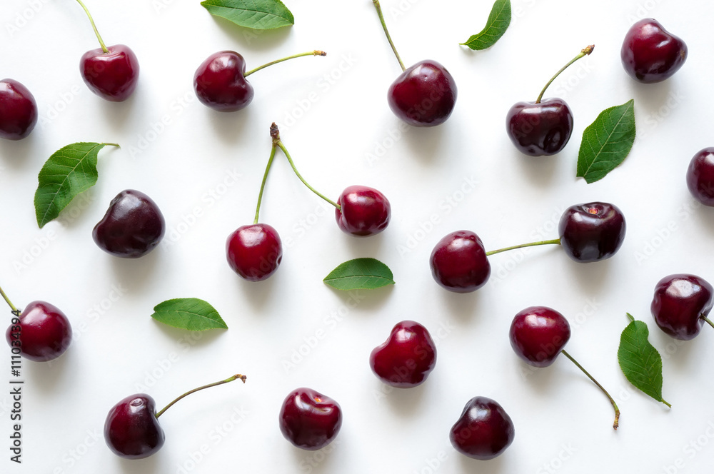 Fresh cherry with leaves. Background for design. Flat lay Fresh cherry with leaves. Background for design. Flat lay