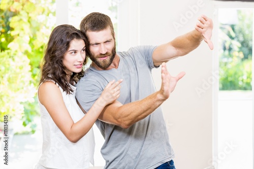 Couple framing a picture with hands  © WavebreakmediaMicro