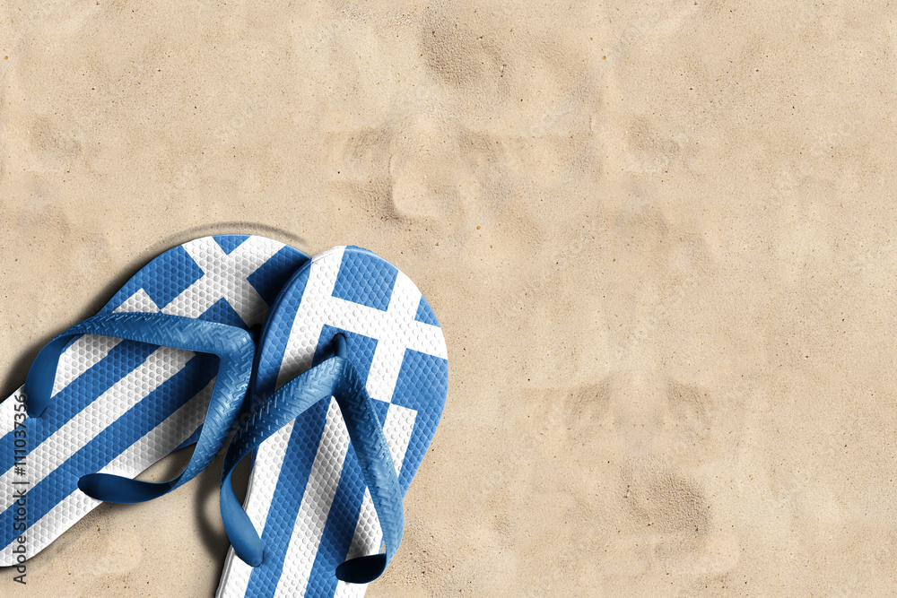 Thongs with flag of Greece, on beach sand - obrazy, fototapety, plakaty 