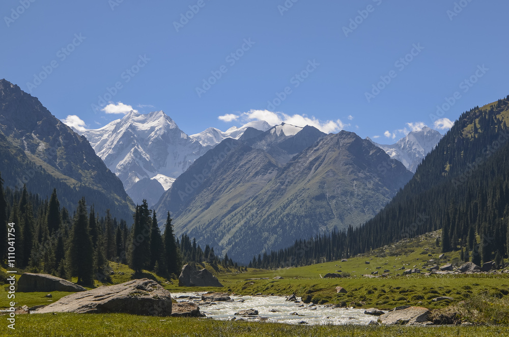 Mountain valley in picturesque mountains in Tian Shan mountain, Karakol, Kyrgyzstan, Central Asia. Sunny meadow in the valley Jety-Oguz, Altyn Arashan Mountain.  Солнечное ущелье в горах Киргизии