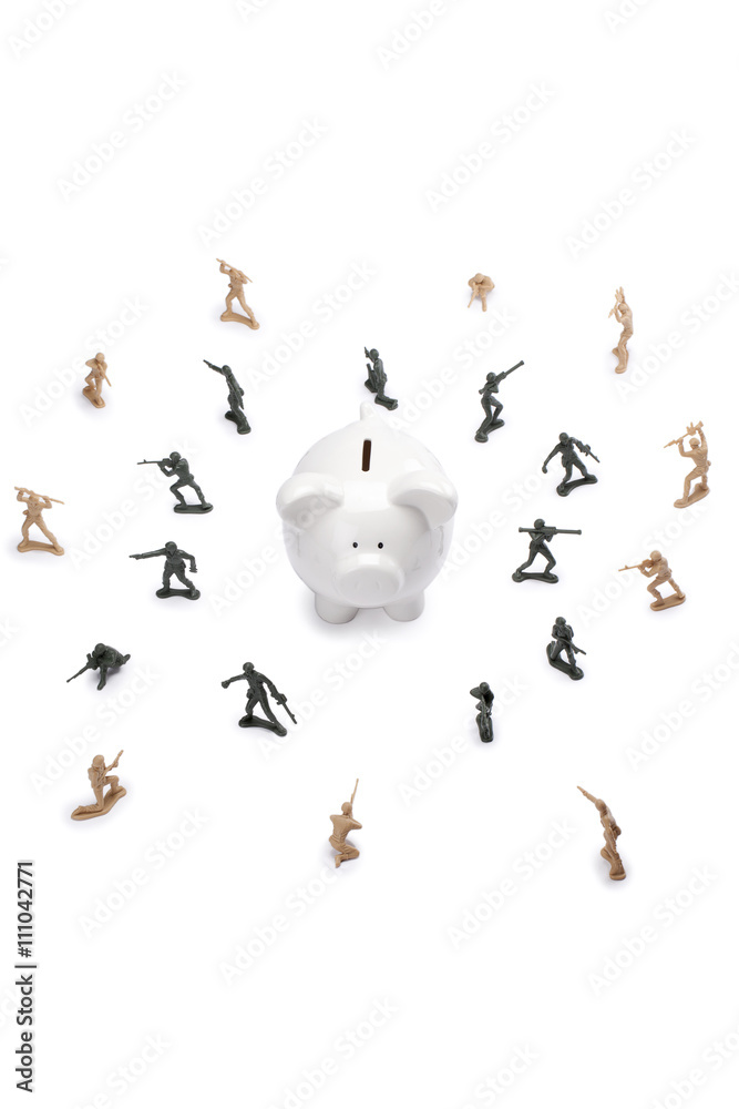 Fototapeta premium military toy soldiers defending the piggy bank