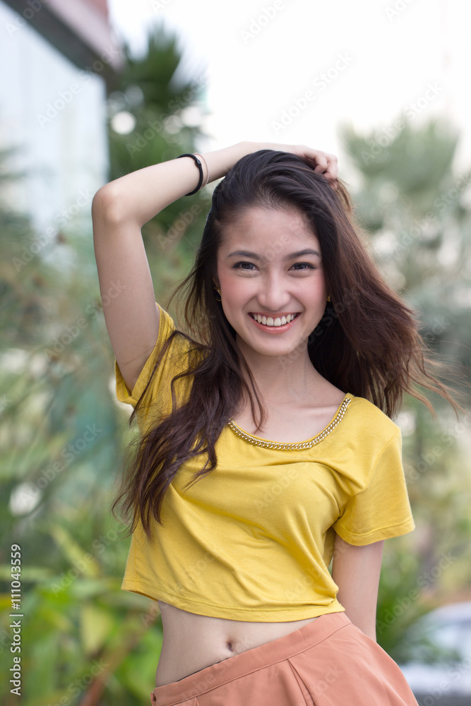 Asian face smiling people standing in garden.