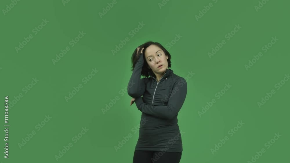 caucasian sporty girl isolated on green screen thinking scratching head caucasian sporty girl isolated on green screen thinking scratching head