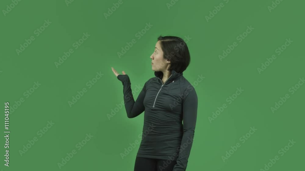 caucasian sporty girl isolated on green screen talking pointing caucasian sporty girl isolated on green screen talking pointing