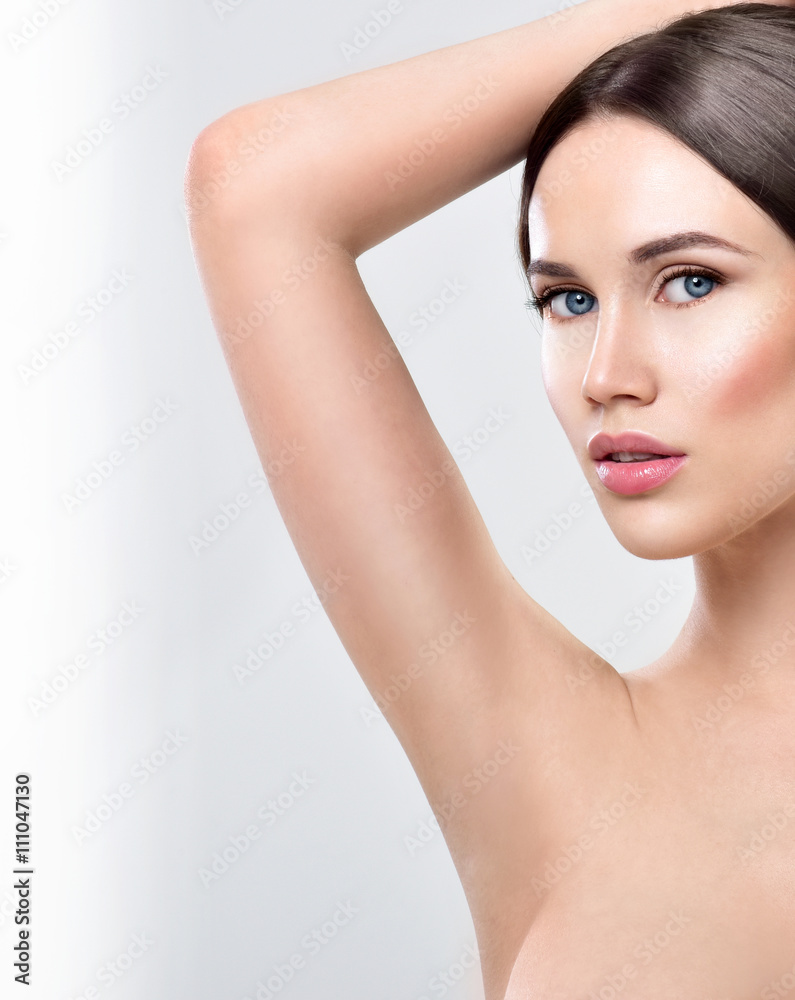 Young beautiful woman. perfect skin. armpit's care Young beautiful woman. perfect skin. armpit's care
