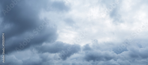 Heavy grey clouds in the sky before snow falling.