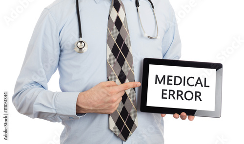 Doctor holding tablet - Medical error