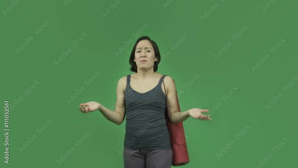 caucasian sporty girl with yoga mat isolated on green screen talking upset caucasian sporty girl with yoga mat isolated on green screen talking upset