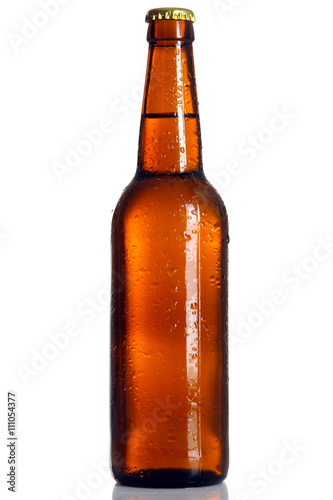 brown glass bottle with light beer on white isolated background