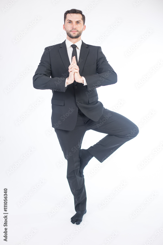 Young male performing yoga Young male performing yoga
