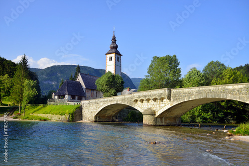 Old St. John church and stone bridge at Bohinj lake, Slovenia