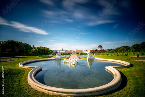 Canvas Print Beautiful fontain in Belvedere with lower palace and park on the background