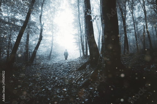 man silhouette on eerie for...
