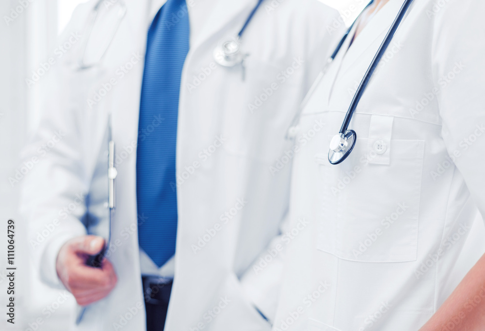 two doctors with stethoscopes two doctors with stethoscopes