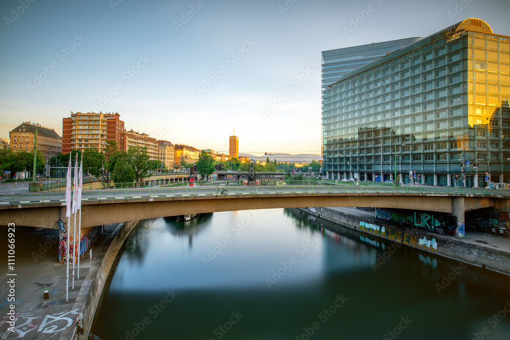 Modern district with contemporary buildings near the water channel in Vienna in the morning