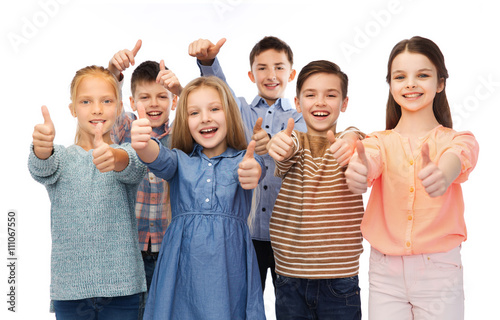 happy children showing thumbs up photo